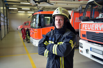 Fototapeta premium portrait of a firefighter in the operations centre at the fire-fighting vehicle