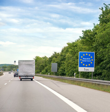 Road sign of Austria on highway border with European Union symbol, travel and transportation concept, crossing into EU country on summer road trip.