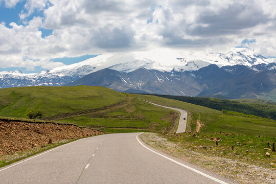 Road to the Dzhily Su against the backdrop of Elbrus in Caucasus mountains