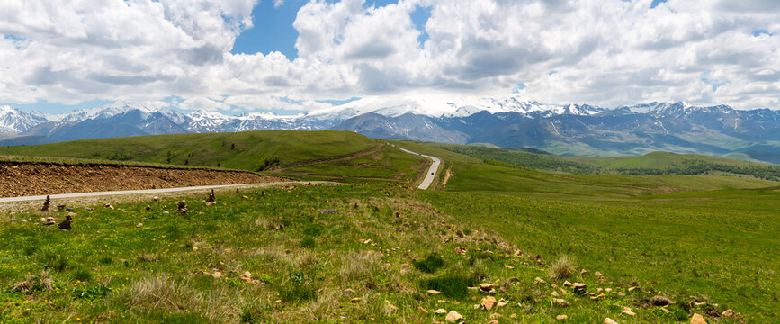 Road to the Dzhily Su against the backdrop of Elbrus in Caucasus mountains