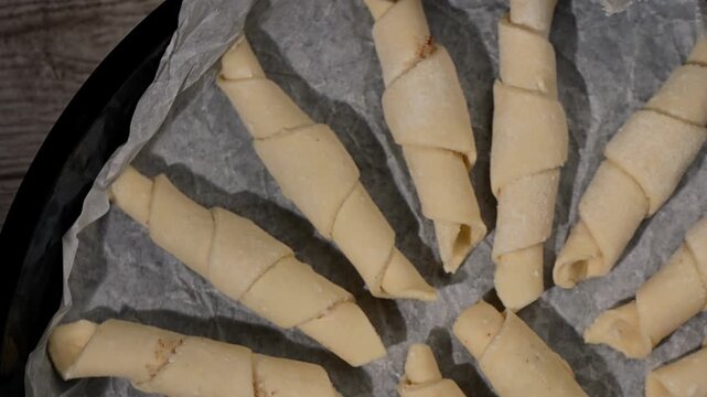 Curd Cheese "Rozhaliki" Pastries Spinning on Baking Tray Before Oven. Top-Down Seamless Loop, Homemade Baking Prep