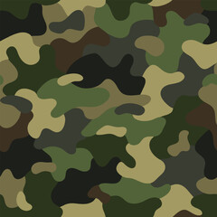 Naklejka premium Seamless khaki green camouflage pattern with overlapping irregular patches of green, beige, brown, black tones. Random composition. For apparel, fabric, textile, sport goods