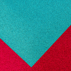 Fototapeta premium Bright blue and red textured paper arranged in a diagonal pattern on a flat surface