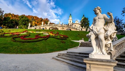 Obraz premium Statue in garden with beautiful architecture.