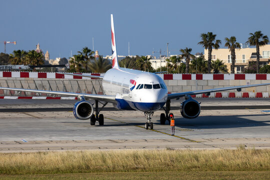 Luqa, Malta - May 4, 2026: British Airways Airbus A321-231 (REG: G-EUXC) coming to a stop on the marshaller's instructions.