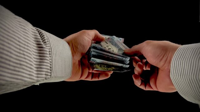 Hands counting Saudi Arabian Riyal banknotes on black background