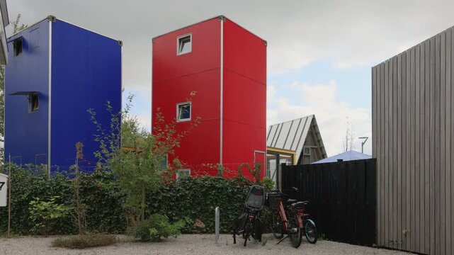 Blue and red tiny houses in Almere, The Netherlands