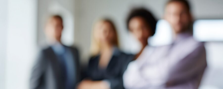 A confident business team stands in a diagonal composition, exuding approachability in a blurred office setting. Soft shadows and cinematic depth highlight teamwork and unity.