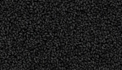Fototapeta premium Close-up of tiny, dark seeds densely packed, creating a textured surface. The seeds appear oblong and uniformly colored