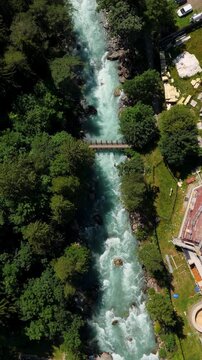 Aerial view of Dora Baltea river with bridge near White Mountain Alps