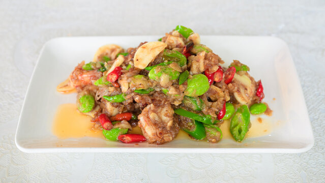 Authentic Phad Sato Kung featuring Thai Stir Fried Stink Beans and Shrimp with Bitter Beans in Southern Thai Food style with Prawns with Shrimp Paste