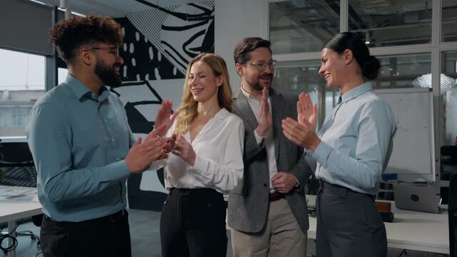 Diversity four colleagues multiethnic business office managers discussing work applause giving high five finding good solution triumph Caucasian businesswomen with Arabian businessmen applauding talk