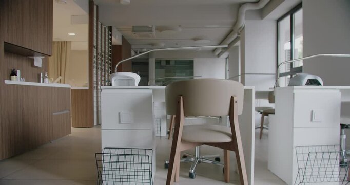 Contemporary beauty salon featuring elegant furniture and a clean, minimalist design. Perfect for showcasing modern interior aesthetics in a professional setting. Modern Beauty Salon
