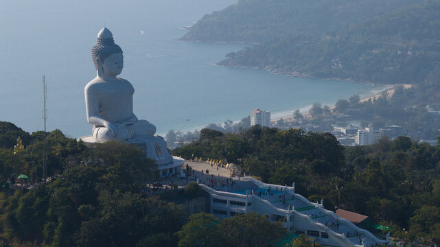 Aerial view of the Phuket Big Buddha statue on Nakkerd Hill with tourists walking on the platform overlooking the Andaman Sea Tambon Karon, Chang Wat Phuket, Thailand.