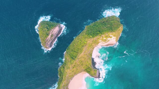 Aerial drone view of Kelingking beach famous T-Rex cliff and turquoise ocean, Bali 4K