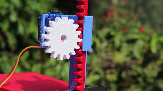 3D printed gear and slider mechanism installed on a micro servo shaft is demonstrating the actual working of the mechanism