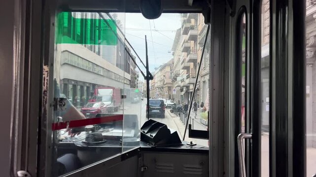 View from the driver's cab of a tram in Milan. The tram travels through the city