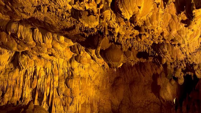 4K video footage of the interior of Ballıca Cave. Stalactites and stalagmites inside the cave. Ballıca, Tokat.