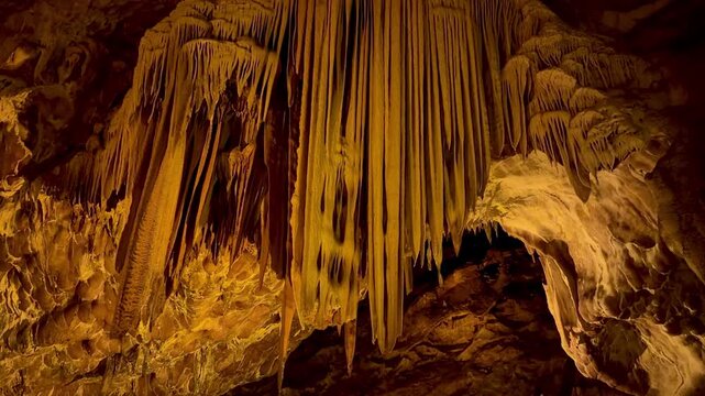 4K video footage of the interior of Ballıca Cave. Stalactites and stalagmites inside the cave. Ballıca, Tokat.