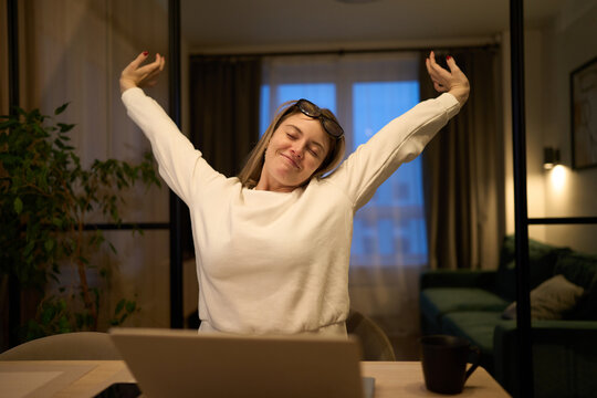 Late-night freelancer enjoying a small stretching break