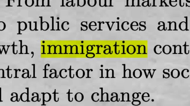 Immigration Highlighted in Newspaper Text Public Policy and Social Issue Concept