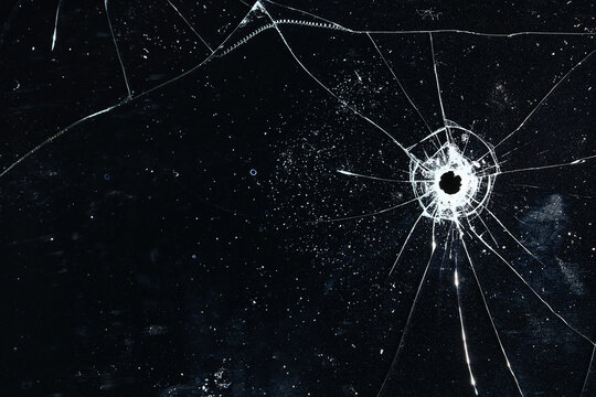 Bullet holes on black glass, overlay design background