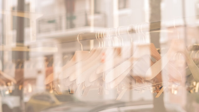 blurred background of a fashion boutique window with hangers