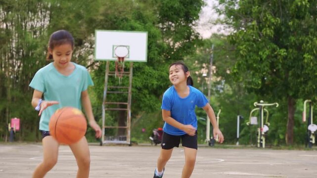 Active students practicing basketball drills during physical education class or after school sports program.