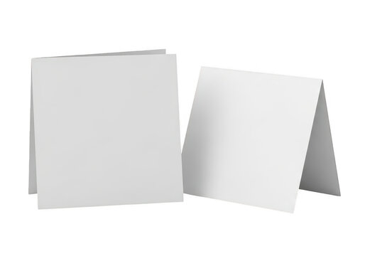Two blank folded paper cards standing on a flat surface for display isolated on transparent background