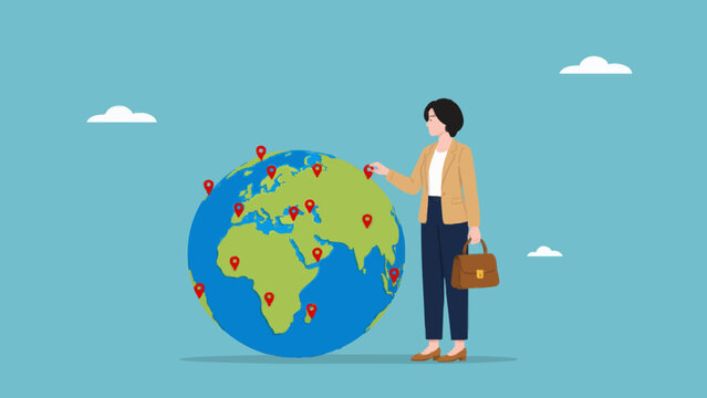 Woman in formal suit choosing location on globe map for business growth strategy.