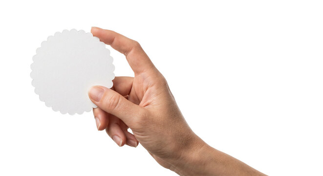 Blank white scalloped paper circle held by hand, round decorative card mockup for branding, empty circular tag for message or price isolated PNG with Transparent Background