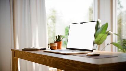 Fototapeta premium Laptop Blank Screen Mockup on Desk in Bright Modern Home Office - Angled View