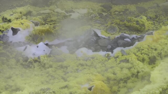 Close-up of vibrant yellow sulfur crystals on a fumarole field. Natural mineral deposits on the slopes of Vulcano Islands, Italy.