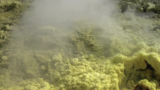 Close-up of vibrant yellow sulfur crystals on a fumarole field. Natural mineral deposits on the slopes of Vulcano Islands, Italy.