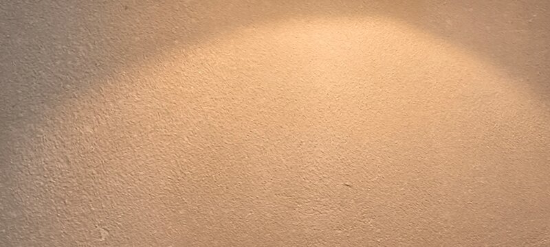 The yellow light hits the wall.
