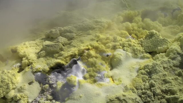 Close-up of vibrant yellow sulfur crystals on a fumarole field. Natural mineral deposits on the slopes of Vulcano Islands, Italy.