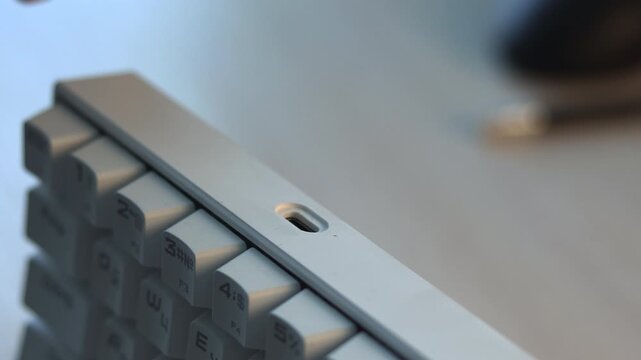 Technician Testing Keyboard Audio Jack. Closeup Of Technician Inserting Connector Into Keyboard Port. Media