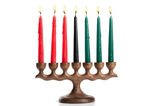 Seven burning Kwanzaa candles in a wooden kinara during celebration Isolated on white background