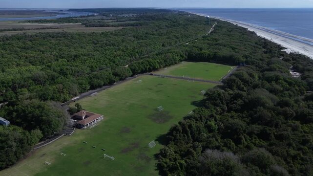 Soccer fields at Jekyll Island, Georgia with natural forest and wetlands 