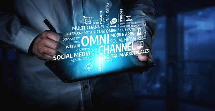 A professional analyzes omni-channel marketing concepts on a tablet, emphasizing modern strategies for customer engagement and effective advertising in a digital workspace. Tessel
