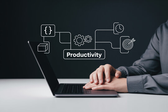 Businessman working on laptop with productivity and development concept icons