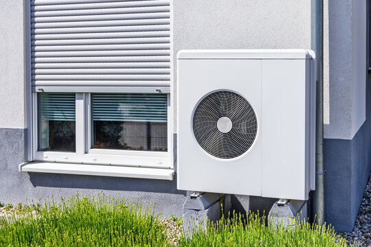 New  air source heat pump installed outside of family house
