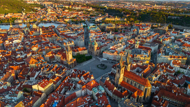 Aerial view of the Old Town Square with the Church of Our Lady before Tyn and historic red rooftops during golden hour in Prague, Prague, Czechia.