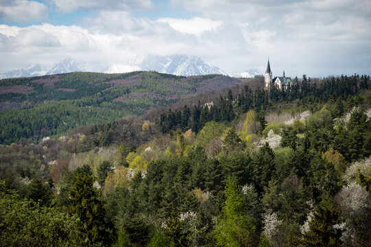 The Basilica of the Visitation on Marianska Hora in Levoca, with the snow-capped High Tatras peaks in the background