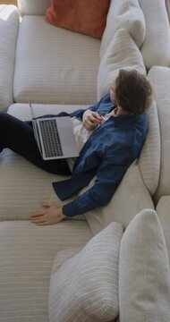 Young Man Working on Laptop at Home, High angle view