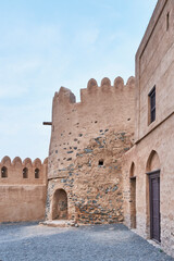 Naklejka premium Ancient Fujairah Fort Architecture, Traditional Arabic Stone Defense Tower in UAE