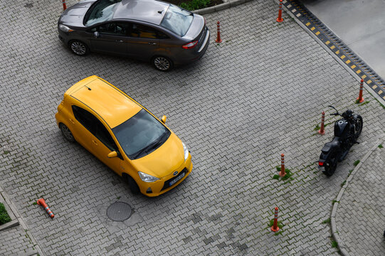 April 2, 2026, Tbilisi, Georgia Yellow Toyota Prius C, subcompact hybrid hatchback