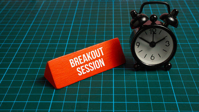 Breakout session sign with black alarm clock on green grid background for event management and scheduling