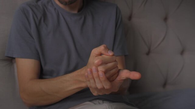 Man striking his fist into an open palm, high quality uncompressed audio recording. Sharp impact sound and expressive gesture. Emphasis, decision and everyday human behavior concept.