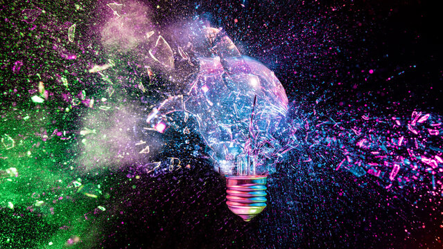 Light bulb exploding with colorful powder